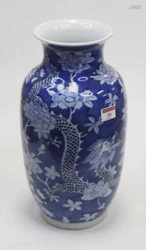 A Chinese export vase of baluster form on a blue ground deco...