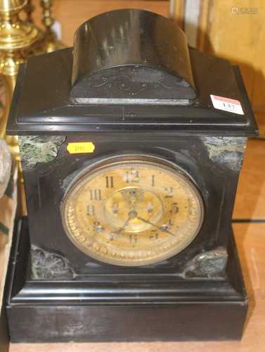 A late 19th century black slate mantel clock, having a gilt ...