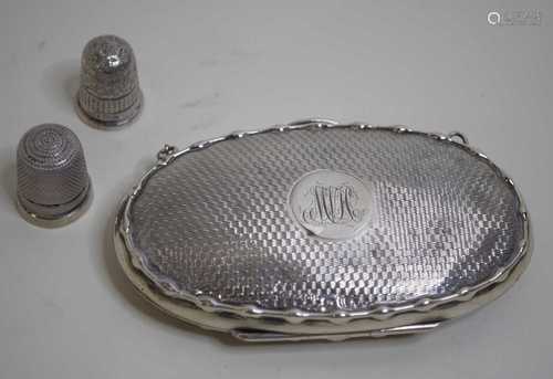 A George V lady's silver purse of oval form having engine tu...