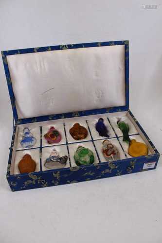 A boxed set of ten modern Chinese snuff bottles with stopper...