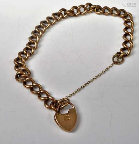 A 9ct gold hollow curblink bracelet with heart shaped padloc...