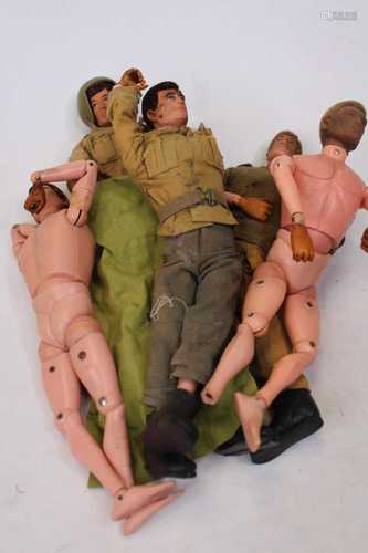 A box containing a collection of Action Man figures, accesso...