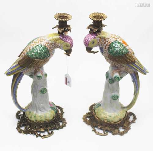 A pair of reproduction Continental porcelain table candlesti...