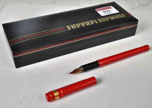 A Ferrari fountain pen, in red and gilt metal tipped case, h...