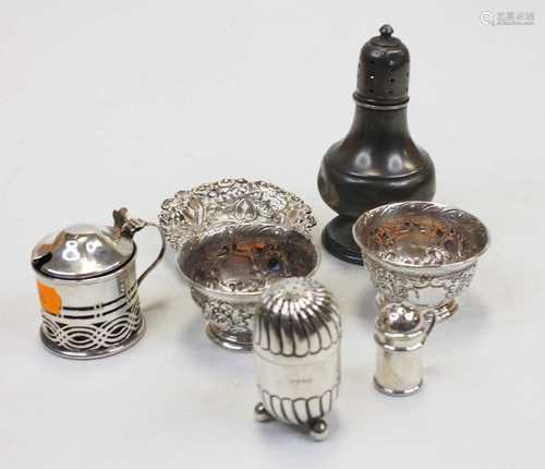 A Victorian silver pepperette; together with a George V silv...