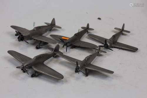 A collection of assorted pewter military aircraft, to includ...