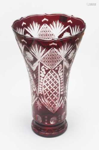 A large Bohemian style ruby overlaid and etched glass vase o...