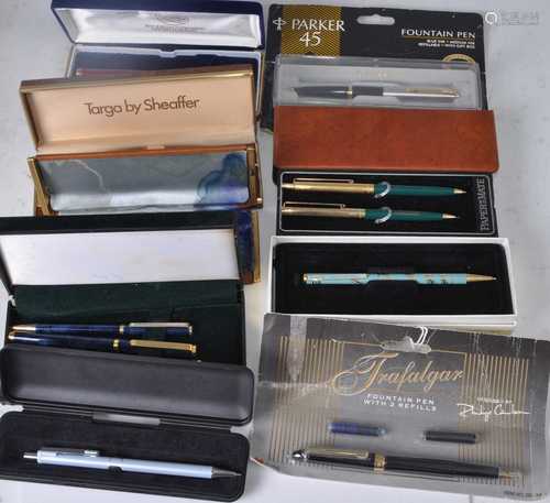 A collection of fountain and ball point pens being boxed and...