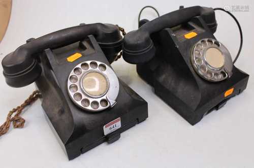 An early 20th century bakelite rotary telephone, together wi...