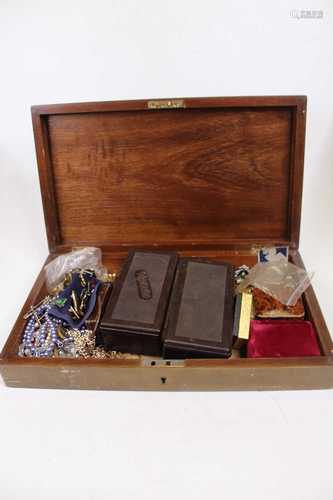 A wooden box containing assorted costume jewellery, enamel p...