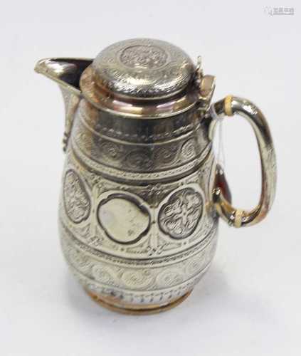 A Victorian silver plated hot water pot, the cover with rais...