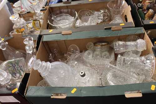 Four boxes of cut and pressed glassware to include decanters