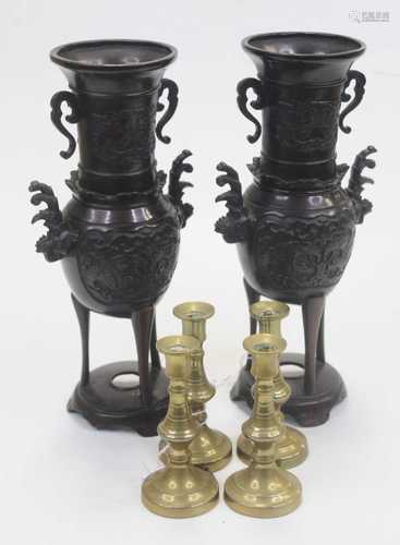 A pair of bronzed vases, each having flared rims to slender ...