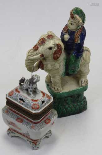 A 19th century Chinese ceramic figure of a dignitary riding ...