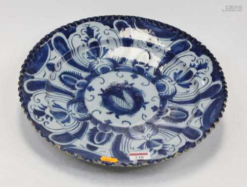 An 18th century Dutch Delft blue and white charger, of typic...