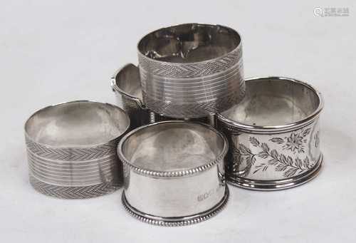 A pair of 20th century silver napkin rings, having engine tu...