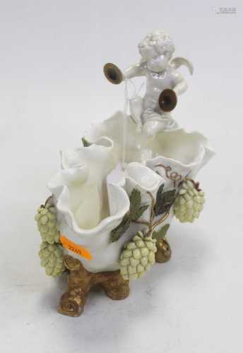 A Victorian Moore Brothers table centrepiece, having a leaf ...