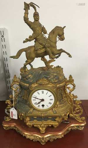 A late 19th century French gilt metal mantel clock having a ...