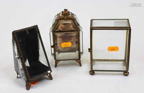 An early 20th century pocket watch holder, enclosed by three...