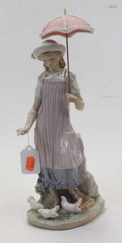 A Lladro Spanish porcelain figure modelled as a young girl, ...