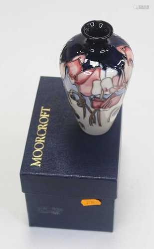 A modern Moorcroft vase, of tapered cylindrical form, typica...