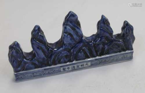 A Chinese export stoneware scholar's rock, the blue glazed r...