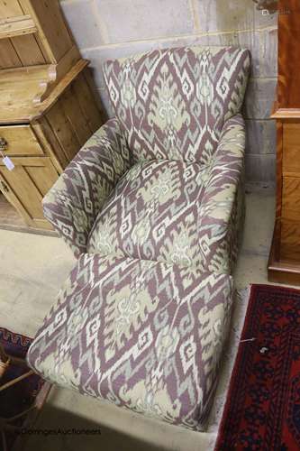 A Kelim upholstered armchair and matching footstool