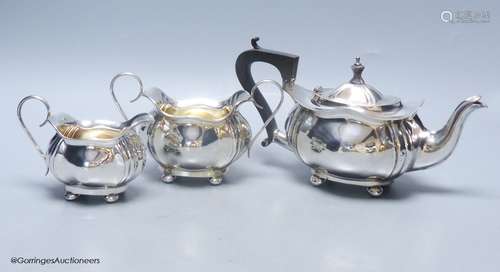 A Scottish silver three-piece tea service, of ribbed, bellie...