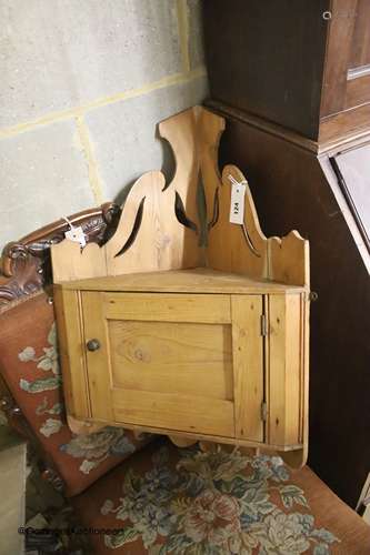 A small late Victorian pine hanging corner cabinet, width 47...