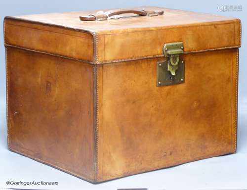 An early 20th century French brown hide travelling case, of ...