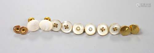 A small collection of assorted dress studs and buttons and c...