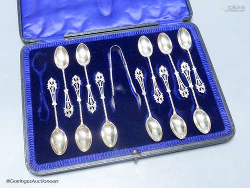 A cased set of eleven (ex 12) pierced silver teaspoons and p...