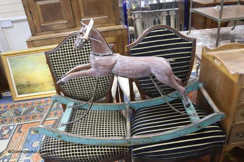 A Victorian cast metal rocking horse, on painted wood bow ro...