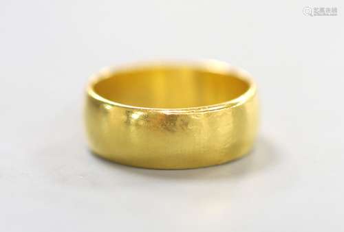 A 22ct gold wedding band, size M, 6.5 grams.