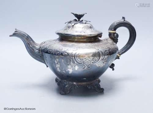 A late William IV embossed silver squat melon shaped teapot,...