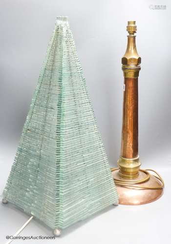 A large copper and brass hose lamp and a modern glass pyrami...