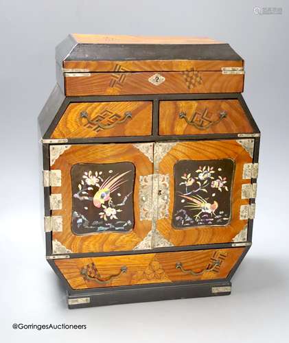 A Japanese lacquer and white metal mounted inlaid table cabi...