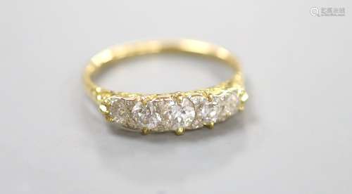 An early 20th century 18ct and graduated five stone diamond ...