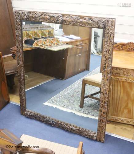 A 19th century rectangular finely carved walnut wall mirror ...