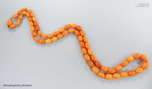 A singe strand oval amber bead necklace, 82cm, gross 45 gram...