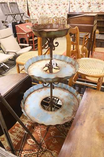 A painted wrought iron three tier plant stand, height 135cm