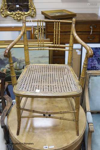 A Regency simulated bamboo caned seat elbow chair