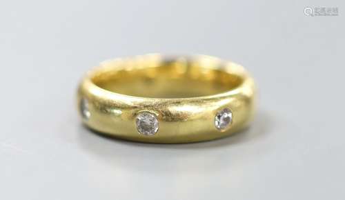 A modern 18ct gold and seven stone diamond gypsy set band, s...