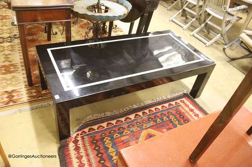 Two lacquered coffee tables, larger width 137cm