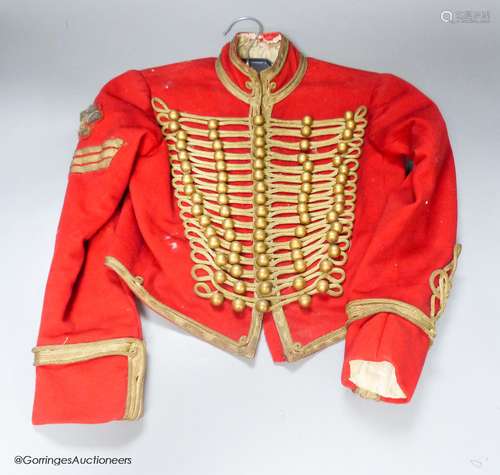 A child's military jacket with silver thread detail