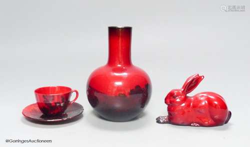 Royal Doulton flambe ware, consisting: a vase, a cup and sau...