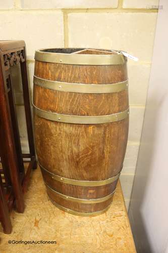 An oval coopered oak barrel stick stand, width 32cm, depth 2...