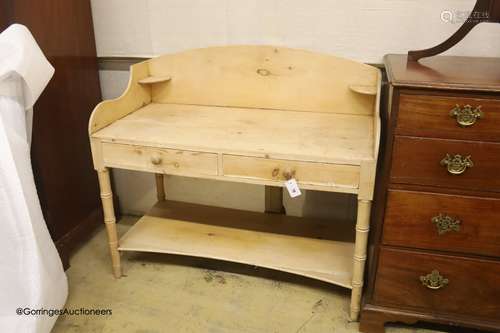 An early 19th century pine two tier washstand, width 105cm, ...