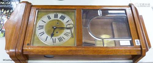 A 1920s German oak wall clock, height 78cm