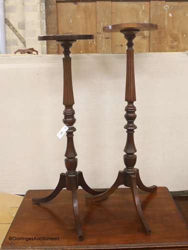 A near pair of reproduction mahogany torcheres, larger 100cm...